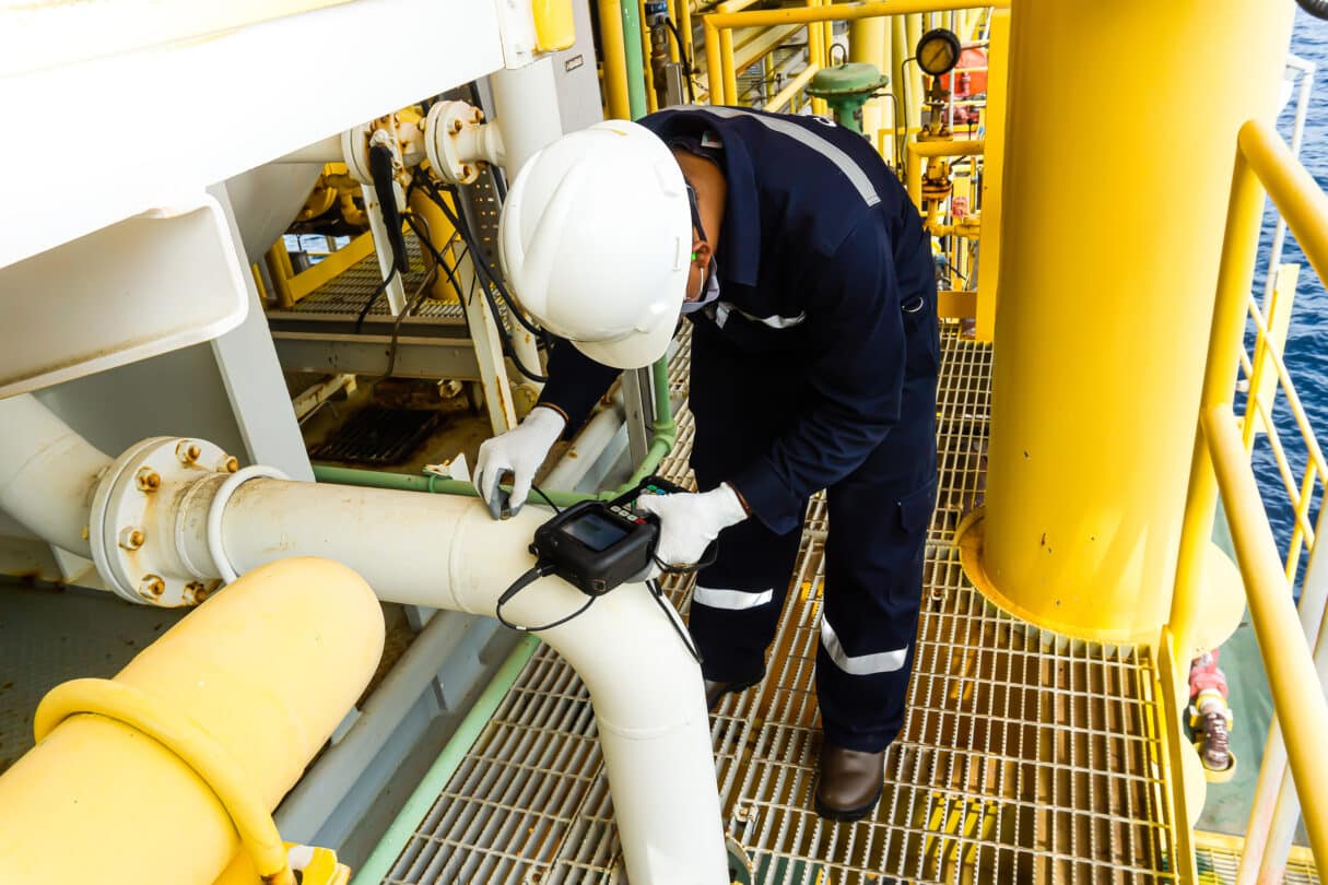 Non-destructive,Testing,Technicians,Are,Checking,The,Thickness,Of,Elbow,Tubes Specialised Marine Products